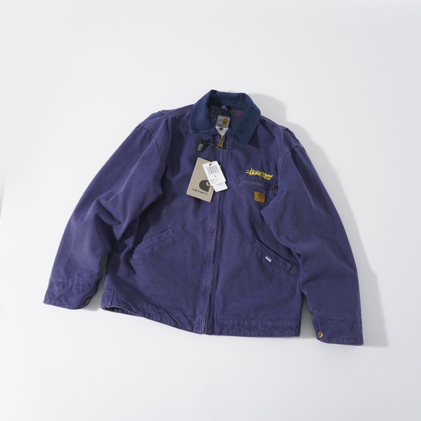 Stussy x Carhartt vintage J97 washed canvas jacket, loose-fitting collared zip-up coat for couples.