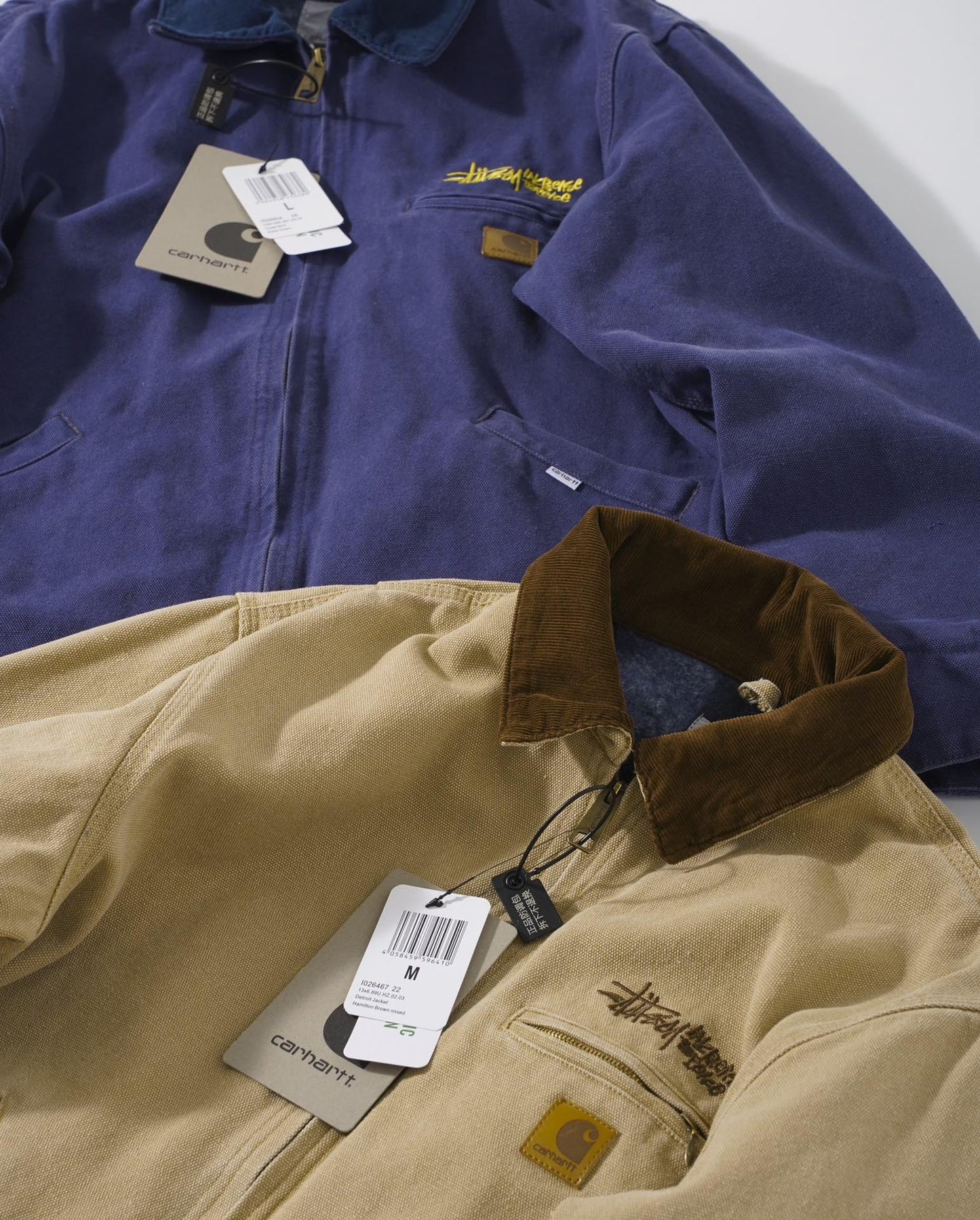 Stussy x Carhartt vintage J97 washed canvas jacket, loose-fitting collared zip-up coat for couples.
