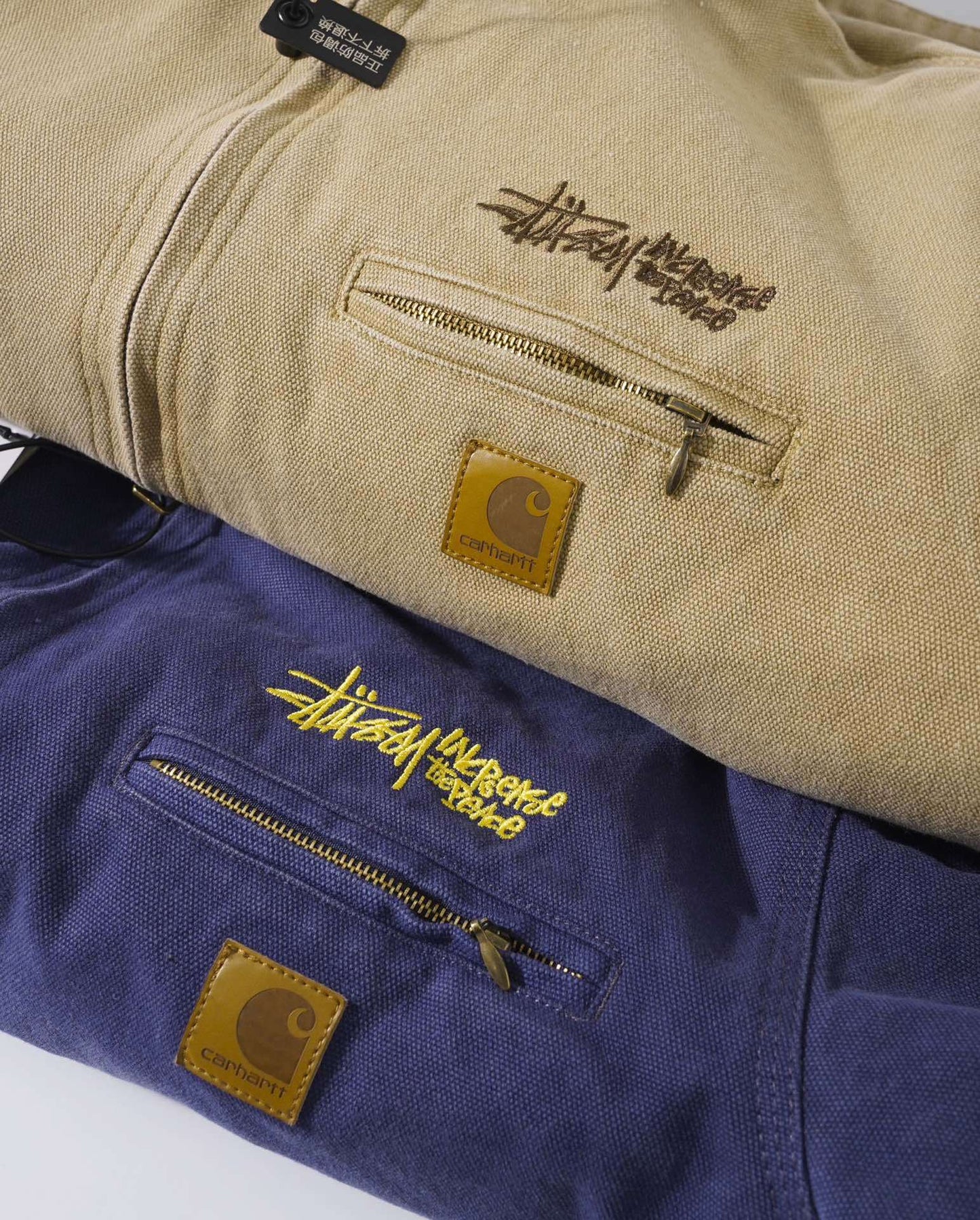 Stussy x Carhartt vintage J97 washed canvas jacket, loose-fitting collared zip-up coat for couples.